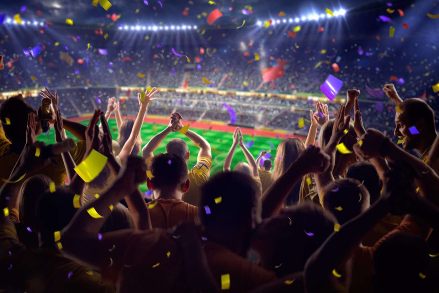 Soccer fans celebrating in a stadium while holding smartphones, symbolizing digital engagement with fan tokens
