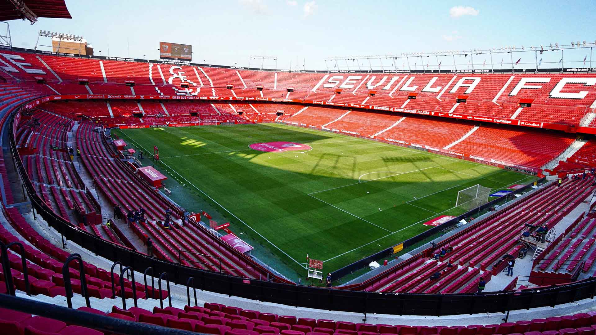 Sevilla FC fans redeeming $SEF fan token rewards at a live match stadium, highlighting Socios.com utility for La Liga supporters